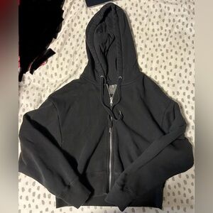 Black cropped zip up hoodie.